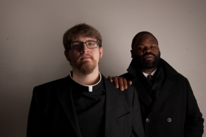Andy Gaitens as Fr. Meyer and Anton Bassey as Dick Gregory